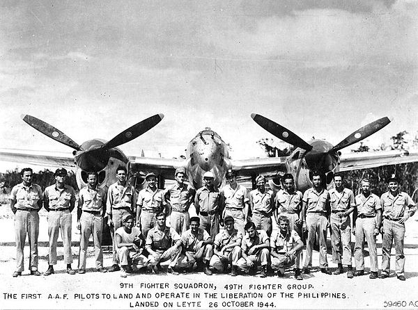 9th Fighter Squadron in front of a P-38 Lightning during the Battle of Leyte in October 1944.