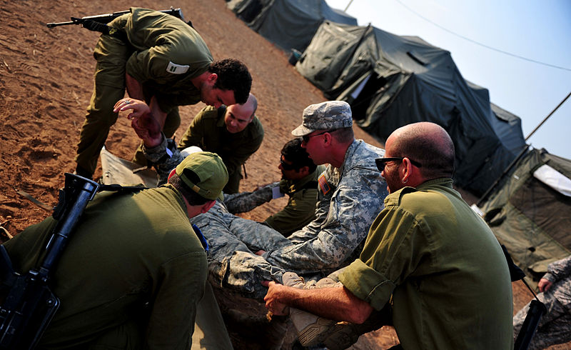 File:A U.S. Soldier with simulated wounds is treated by U.S. Army and Israel Defense Forces medics during a medical exercise for Austere Challenge 2012 in Beit Ezra, Israel 121022-F-QW942-079.jpg