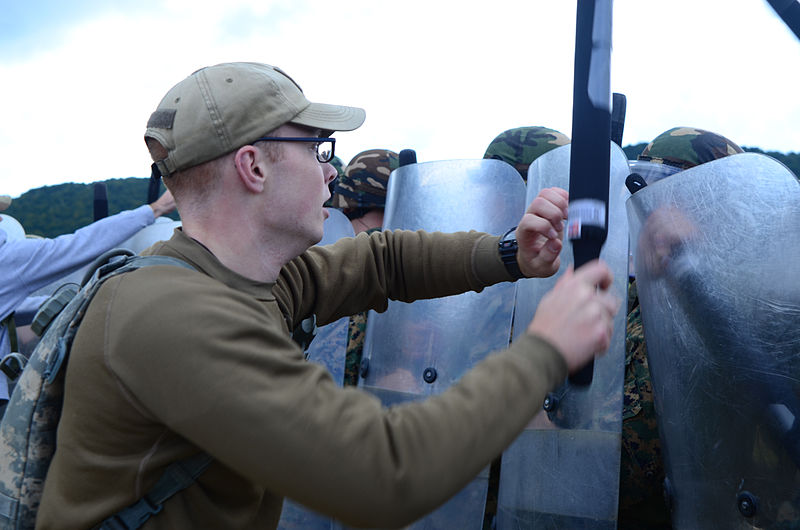 File:A U.S. Soldier with the 1st Battalion, 4th Infantry Regiment acting as a rioter harasses Bosnian-Herzegovinian soldiers Aug. 27, 2014, during Saber Junction 2014 at the Joint Multinational Readiness Center 140827-A-AO952-007.jpg