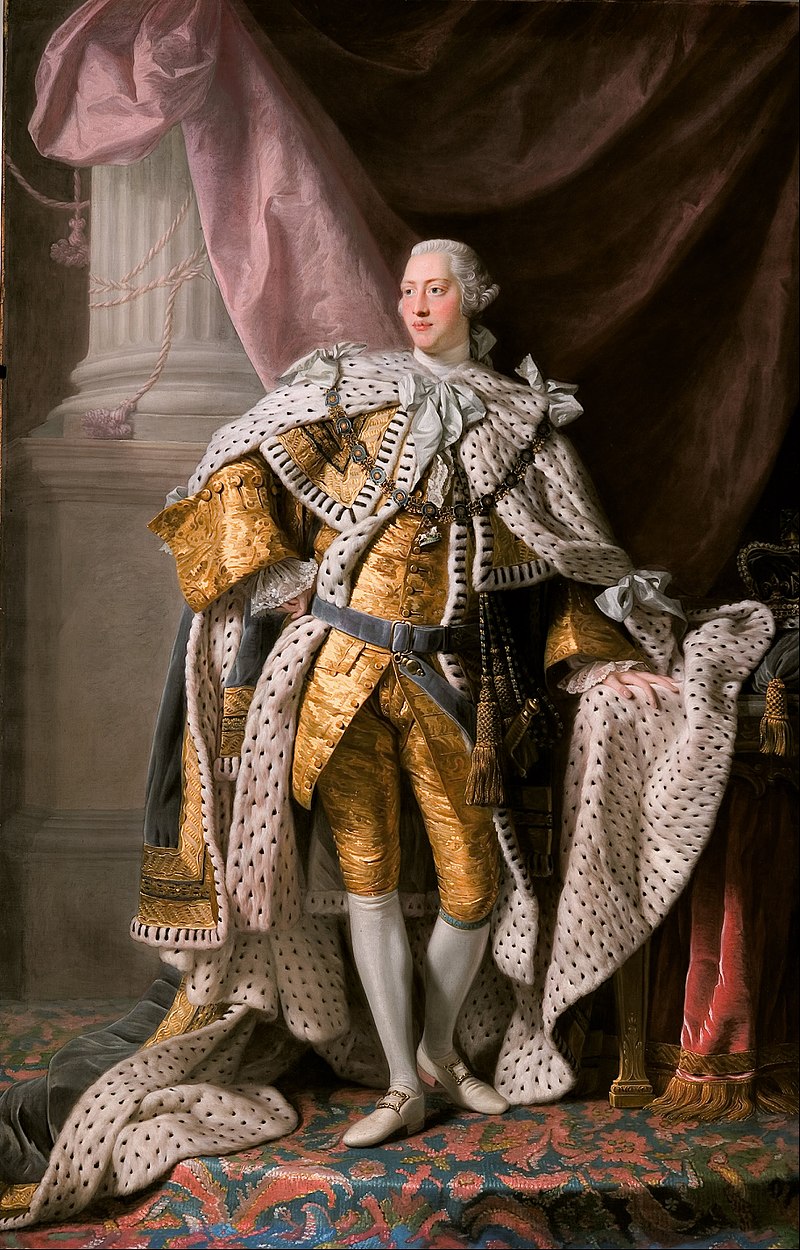 Full-length portrait in oils of a clean-shaven young George in eighteenth century dress: gold jacket and breeches, ermine cloak, powdered wig, white stockings, and buckled shoes.