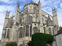 The chevet of Bourges Cathedral. Each radiating chapel has its own small sub-chapel, topped by a small spire. Double flying buttresses support the upper and middle level walls.