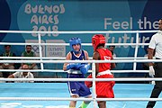 Deutsch: Boxen bei den Olympischen Jugendspielen 2018 Tag 12, 18. Oktober 2018 - Finale Fliegengewicht Mädchen – Martina La Piana (Italien, blau) schlägt Adijat Gbadamosi (Nigeria, rot) 5-0; Ringrichter ist James Beckles (Trinidad und Tobago). English: Boxing at the 2018 Summer Youth Olympics on 18 October 2018 – Girl's flyweight Gold Medal Bout - Martina La Piana (Italy, blue) beats Adijat Gbadamosi (Nigeria, red) 5-0; Referee is James Beckles (Trinidad and Tobago). Español: Boxeo en los Juegos Olímpicos Juveniles de Verano de 2018 en 18 de octubre de 2018 - Combate a medalla de oro de peso mosca para mujeres: Martina La Piana (Italia, azul) le gana a Adijat Gbadamosi (Nigeria, roja) 5-0; El árbitro es James Beckles (Trinidad y Tobago).