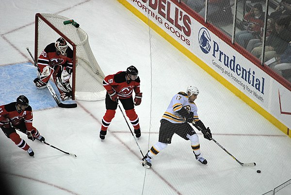 New Jersey Devils goaltender Martin Brodeur (top left) positions himself along the net during a 2008 game against the Boston Bruins. Brodeur's exploit