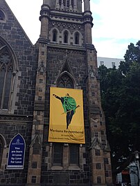 A yellow banner on the church in remembrance of the Marikana massacre.