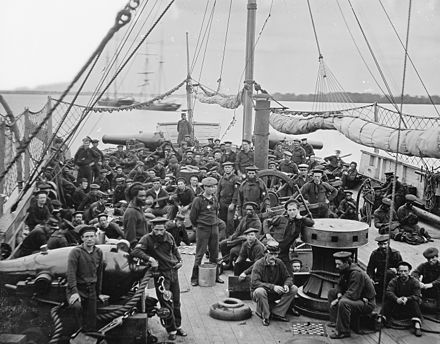 U.S. Navy sailors, on board an 1864 river gunboat