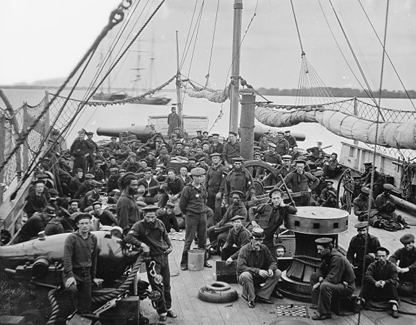 U.S. Navy sailors, on board an 1864 river gunboat