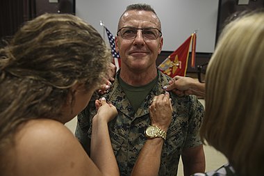 Lt. Gen. Robert F. Hedelund, Commanding General, II Marine Expeditionary Force (II MEF), is pinned by family members during his promotion ceremony on Camp Lejeune, N.C., July 14, 2017.