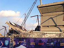 The Metrodome on February 26, 2014, with about half of its walls demolished. These are the north and west stands. Demolition of the Metrodome.jpg