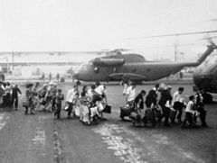 Vietnamese evacuees board a CH-53 at LZ 39