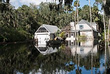 Floodwaters surrounding a home in Deltona FEMA - DR4337 Water engulfs yards at Deltona, Florida, home in Volusia.jpg