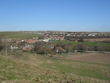 In 1970, nearly 50 acres (20 ha) of Ovingdean--an ancient village east of Brighton--was designated a conservation area. General view of Ovingdean from Cattle Hill.jpg