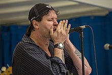 Jason Ricci performing on stage