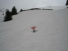 Warning sign about NATO cluster bombs near ski slopes at Kopaonik Kop mine mines.jpg