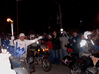 Edwards carrying the Olympic Torch in 2002