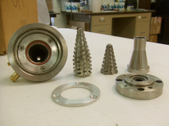 Low-pressure mix head components, including mix chambers, conical mixers, and mounting plates