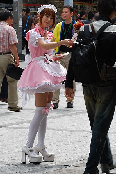 A maid distributing flyers in Akihabara