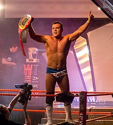 Scurll as the British Cruiserweight Champion in April 2012 Marty Scurll British Cruiserweight Champion.jpg