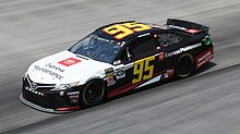 DiBenedetto's No. 95 car during the 2019 Bass Pro Shops NRA Night Race Matt dibenedetto (48571866312).jpg