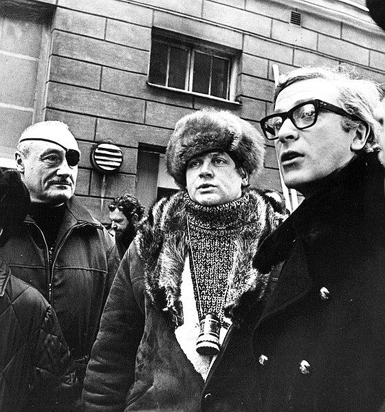 Producer Andre de Toth, Ken Russell, and Michael Caine in Helsinki during production of Billion Dollar Brain, in Sofiankatu, Finland (1967)