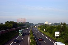 Blick auf die Umgehungsstraße B 51 mit der Kreuzung mit dem Albersloher Weg und dem Gasometer im Hintergrund