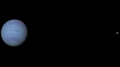 Neptune and Triton with their sizes and distance from each other to scale.png