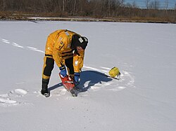 Cutting a hole in the ice to check the water conditions Nesconset FD Scuba rescue team training dive Lake Ronconkoma NY 179846 1762646500254 1061841085 1955377 2462382 n.jpg