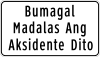 Bumagal, madalas ang aksidente dito (Slow down, accident prone area)