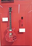 Taylor Swift's Les Paul guitar and cordless microphone in the Musical Instrument Museum of Phoenix.