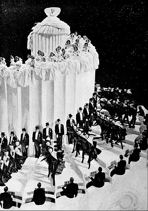 The extravagant "Wedding Cake" sequence featured a towering rotating volute of 70 ft diameter with 175 spiral steps, weighing 100 tons. This number, "A Pretty Girl is Like a Melody", won the Academy Award for Best Dance Direction for 1936. Photo from The Great Ziegfeld 1936.jpg