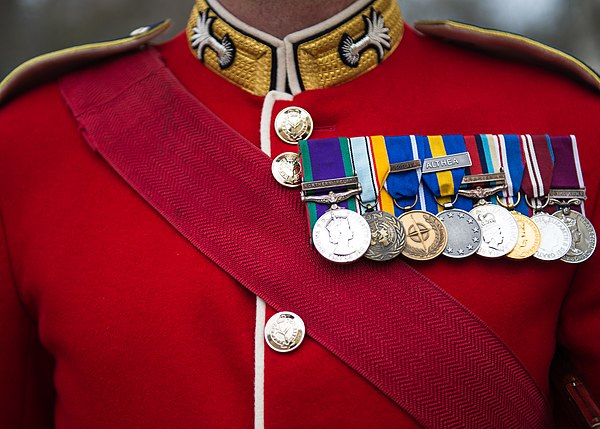 A scarlet tunic worn by a warrant officer of the Welsh Guards