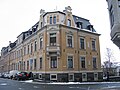 Tenement house with fencing in a corner in a closed development