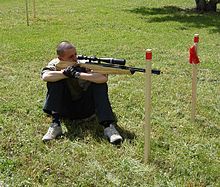 An athlete fires from the sitting position at a Field Target (FT) shooting event Posizione libera.jpg