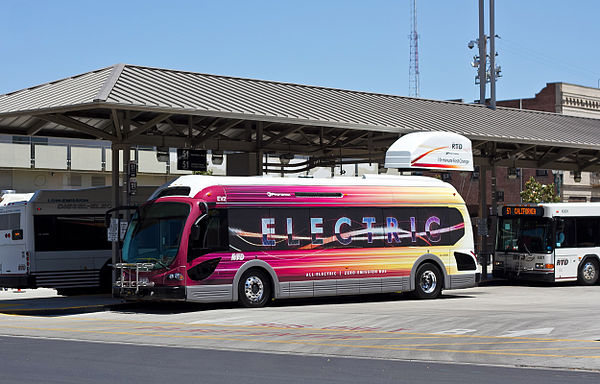 A battery electric Proterra BE35 bus operated by San Joaquin RTD beside its fixed charging station