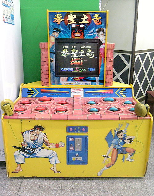 A Whac-A-Mole Street Fighter II arcade game features Ryu and Chun-Li.