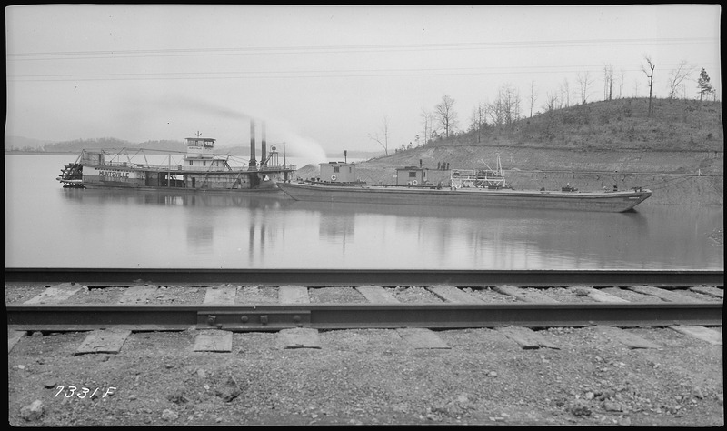 File:River channel improvement, barge unloading at Gulf Refining Company - NARA - 280795.tif