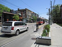 Bumpout or bulb in Toronto serving streetcar riders and cyclists RoncesvallesAvenueBumpout.JPG