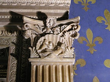 Renaissance reinterpretation of the Corinthian order, with a capital with Venus and Eros, in the Sala dei Gigli, Palazzo Vecchio, Florence, Italy, by Benedetto da Maiano, 1476–1481.[20]