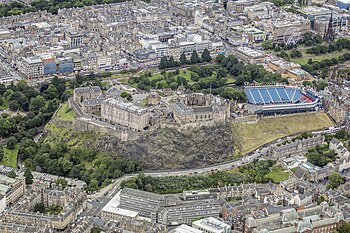 Edinburgh Castle, with the New Town beyond, is at the heart of the Edinburgh World Heritage Site Scotland-2016-Aerial-Edinburgh Castle.jpg