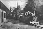 Steam hauled phosphate train passing through the village of Vaitepaua in the north of the island Makatea. The locomotive, No. 5, is an 0-8-0TT built by Orenstein & Koppel (Peter Dyer collection).jpg