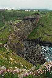 Overlooking the ruins of Tintagel Castle. Part of the village of Tintagel (Trevena) can be seen in the distance TintagelCastle.jpg
