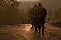 U.S. soldiers walk toward the rising sun during the 10-kilometer road march at the 2013 Army Reserve Best Warrior competition at Fort McCoy.jpg
