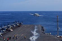 An E-2C Hawkeye takes off from the USS Theodore Roosevelt (CVN-71) in 2019 USS Theodore Roosevelt (CVN 71) conducts flight operations. (49122248696).jpg