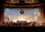 The United States Navy Band Concert Band performs traditional and popular holiday music for the television special, "Happy Holidays" at DAR Constitution Hall in Washington, D.C., 2001.
