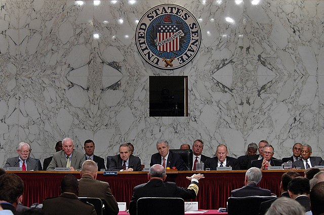 The Commission questions Gordon R. England, Vern Clark, and Michael Hagee in 2005.