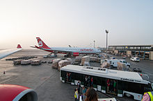 Airport bus parked at Abu Dhabi Intl Airport 13-08-06-abu-dhabi-airport-46.jpg