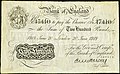 A Bank of England 1918-as fehér 200 fontos bankjegye, E.M. Harvey főpénztáros aláírásával. Mérete: 211 x 133 mm.