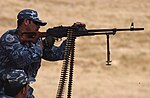 A Kurdish Peshmerga officer fires a PKM in Mosul,.jpg