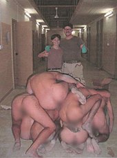 This photograph from Abu Ghraib released in 2006 shows a pyramid of naked Iraqi prisoners. Abu Ghraib 53.jpg