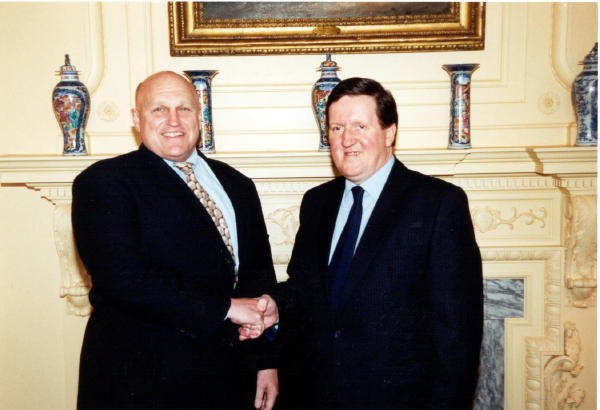 Deputy Secretary of State Richard Armitage and NATO Secretary General Lord Robertson meet in 2002