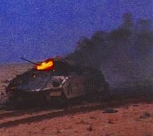 A Bradley IFV burns after being hit during the Battle of 73 Easting, one of only three Bradleys lost to the Iraqis, February 1991. Bradley on fire.jpg